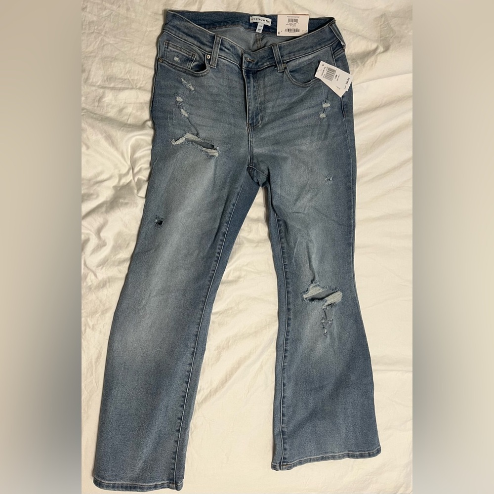 And Now this distressed Jeans size 14W